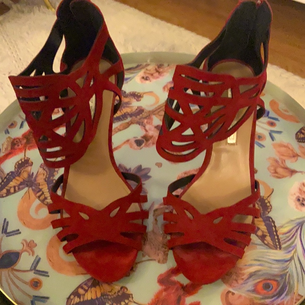 Red suede open toe pumps